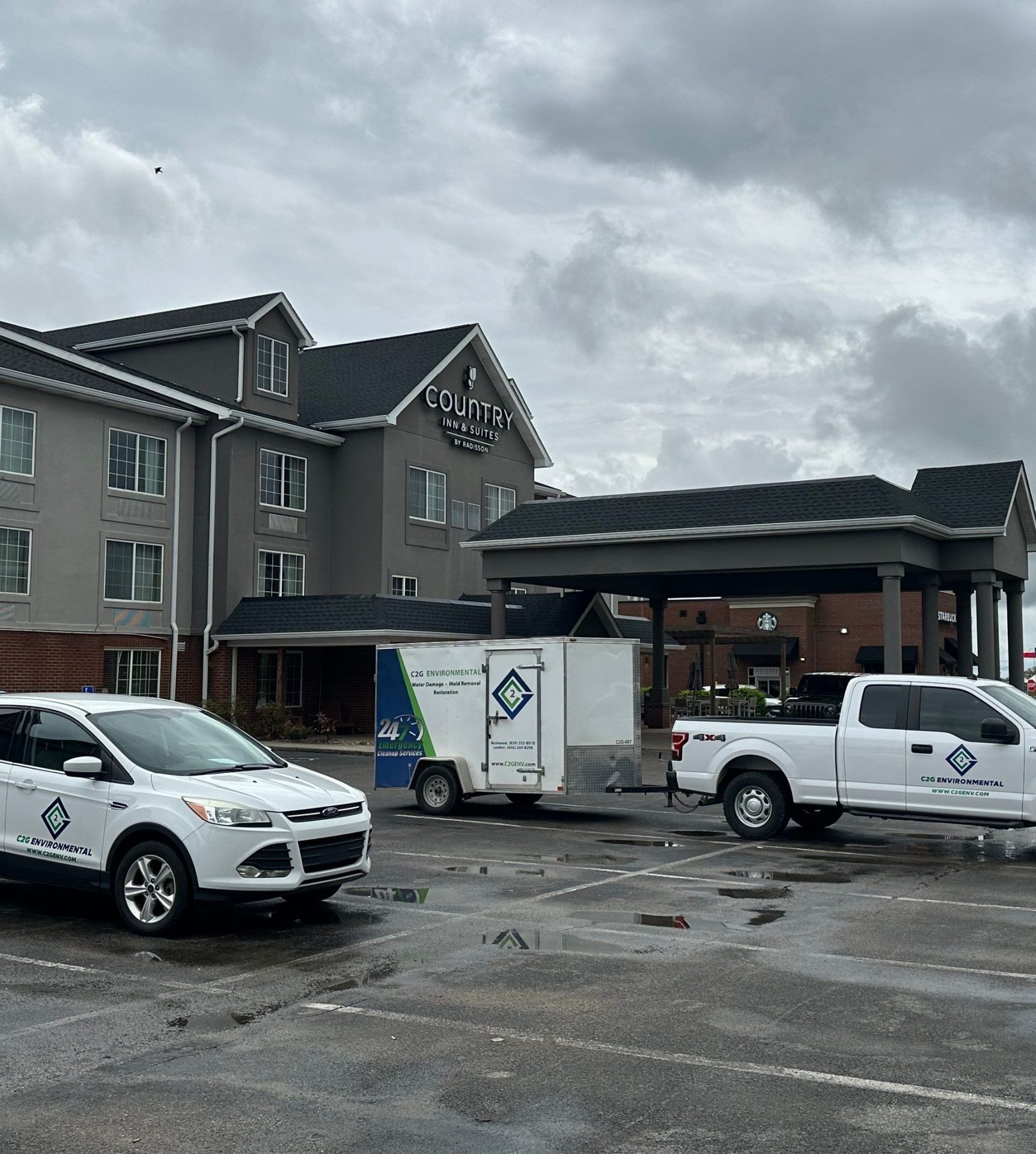 C2G Environmental vehicles and trailer at a hotel during service response