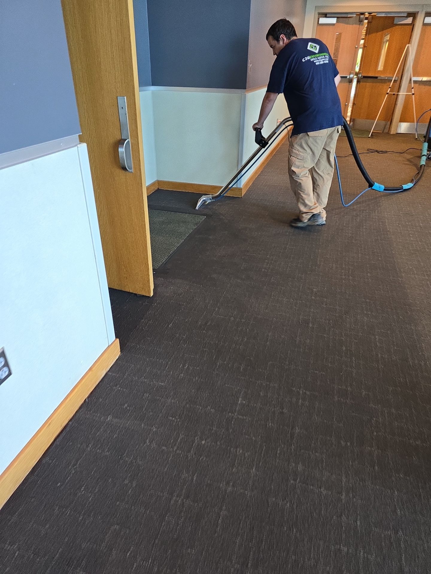 C2G technician extracting water from carpet in a church