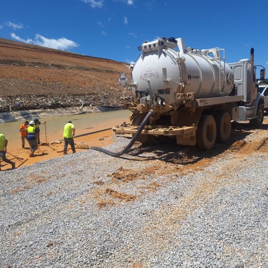 C2G crew using a vacuum truck to remove leachate at a landfill