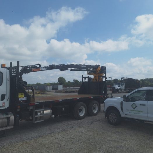 C2G railroad grapple truck and support vehicle at rail work site