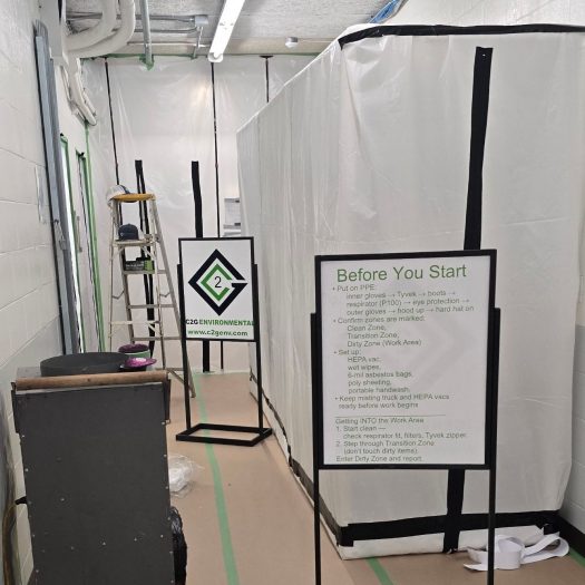 C2G Environmental signage surrounding an asbestos containment area