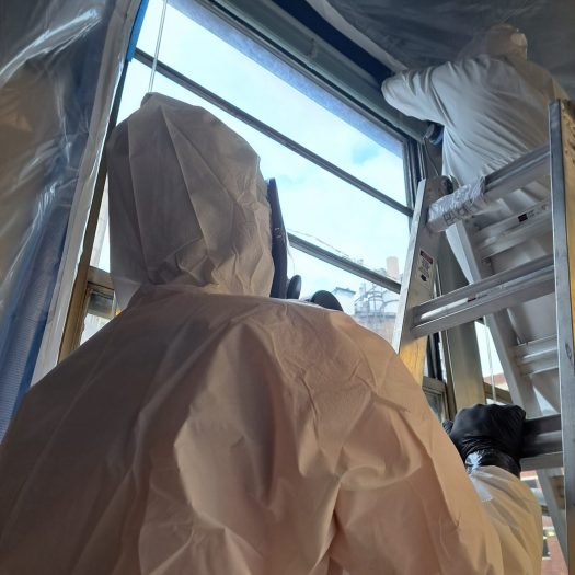 C2G Environmental technicians sealing room for asbestos containment