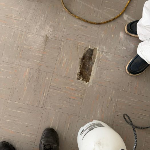 C2G Environmental technicians during an asbestos tile abatement project