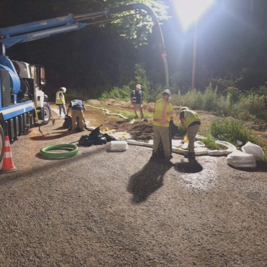 C2G emergency response crew and vacuum truck handling a nighttime spill