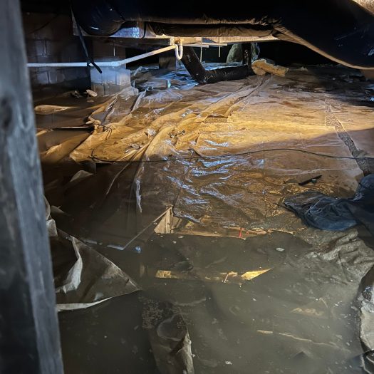 Flooded crawlspace with extensive standing water requiring water extraction